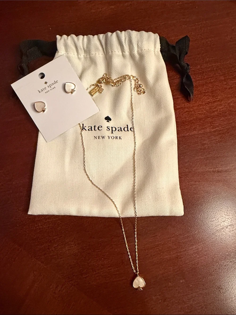 kate spade gold-tone necklace and stud earrings with cream enamel hearts